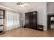 Flexible bonus room with hardwood floors, and stylish Murphy bed for guests at 5215 W Del Rio St, Chandler, AZ 85226