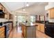Well-appointed kitchen with an island, stainless steel appliances, and an adjacent dining area with lots of natural light at 5215 W Del Rio St, Chandler, AZ 85226