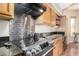 Updated kitchen featuring stainless steel appliances, granite countertops, and light wood cabinetry at 5215 W Del Rio St, Chandler, AZ 85226
