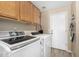 Laundry room featuring modern appliances and neutral color paint at 5215 W Del Rio St, Chandler, AZ 85226