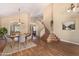 Bright, open living room with dining area, high ceilings, hardwood floors and staircase at 5215 W Del Rio St, Chandler, AZ 85226