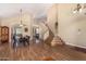 Inviting formal living and dining areas featuring high vaulted ceilings, elegant staircase, and wood-look flooring at 5215 W Del Rio St, Chandler, AZ 85226