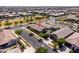 An aerial view shows the neighborhood with single-Gathering homes and well-manicured landscaping at 5616 S Caisson Way, Mesa, AZ 85212