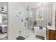 This bathroom has shiplap walls, a modern glass shower, and a soaking tub beneath the beautiful patterned tile at 5616 S Caisson Way, Mesa, AZ 85212
