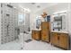 This bathroom offers dual vanities, shiplap walls, a chandelier, a shower, a tub, and intricate tile work at 5616 S Caisson Way, Mesa, AZ 85212