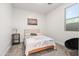 This bedroom offers natural light, neutral walls, gray carpet, and comfortable modern decor at 5616 S Caisson Way, Mesa, AZ 85212