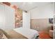 Bedroom with light-colored walls, a large window, and cactus-themed wallpaper at 5616 S Caisson Way, Mesa, AZ 85212
