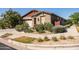 Charming single-story home with lovely desert landscaping and inviting curb appeal at 5616 S Caisson Way, Mesa, AZ 85212