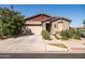 Charming single-story home with a two-car garage and well-maintained landscaping at 5616 S Caisson Way, Mesa, AZ 85212