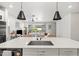 Open kitchen with a large island and sink overlooking the living area at 5616 S Caisson Way, Mesa, AZ 85212