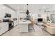 Bright open floor plan with a spacious kitchen, large island and stainless steel appliances at 5616 S Caisson Way, Mesa, AZ 85212