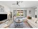 Bright and open living room with lots of sunlight and stylish furnishings at 5616 S Caisson Way, Mesa, AZ 85212