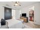 Bright main bedroom with a ceiling fan, a sliding barn door and a spacious walk-in closet at 5616 S Caisson Way, Mesa, AZ 85212