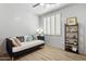 This inviting bedroom offers lots of natural light, a comfortable daybed, and modern shelving at 5909 W Blue Sky Dr, Phoenix, AZ 85083