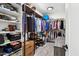 Well-organized walk-in closet with ample storage space for clothes and accessories at 5909 W Blue Sky Dr, Phoenix, AZ 85083