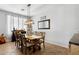 Comfortable dining room with a wooden table and ample seating for gatherings at 5909 W Blue Sky Dr, Phoenix, AZ 85083