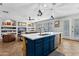 Bright kitchen featuring a large island with marble countertop, modern pendant lights, and stainless steel appliances at 5909 W Blue Sky Dr, Phoenix, AZ 85083