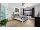Serene main bedroom with a view, wooden floors, and access to the ensuite bathroom at 5909 W Blue Sky Dr, Phoenix, AZ 85083