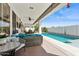This outdoor patio provides seating next to a refreshing private pool at 5909 W Blue Sky Dr, Phoenix, AZ 85083
