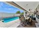 Inviting backyard boasts a refreshing pool and covered patio area, ideal for outdoor relaxation and entertaining at 5909 W Blue Sky Dr, Phoenix, AZ 85083
