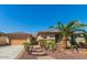 Charming single-story home with a well-manicured front yard, desert landscaping, and a paved walkway at 6528 W Brookhart Way, Phoenix, AZ 85083