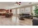 Spacious living space with wood floors, great for entertaining, and seamlessly connects kitchen and living room at 6528 W Brookhart Way, Phoenix, AZ 85083
