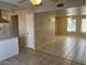 Open living area with tile flooring and view into kitchen with stainless steel hood at 6624 S Granada Dr, Tempe, AZ 85283