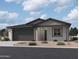 Charming single-story home featuring a two-car garage and low-maintenance desert landscaping at 7713 W Avenida Del Rey --, Peoria, AZ 85383