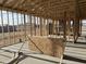 Interior view of a new home under construction displaying the wall and roof framing at 7713 W Avenida Del Rey --, Peoria, AZ 85383