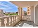 View from balcony with concrete pillars and railing overlooking building and desert landscape under sunny skies at 7930 E Camelback Rd # 301, Scottsdale, AZ 85251