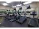 Fully equipped fitness center with state-of-the-art cardio machines, weights, and mirrors for a complete workout experience at 7930 E Camelback Rd # 301, Scottsdale, AZ 85251