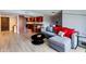 An open-concept living room featuring a modern couch and view of the kitchen at 7930 E Camelback Rd # 301, Scottsdale, AZ 85251