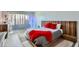 Bright bedroom with a wooden slat headboard, a large window, and a view at 7930 E Camelback Rd # 301, Scottsdale, AZ 85251
