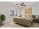 Bright bedroom with neutral tones, plantation shutters, and a cozy atmosphere at 9417 E Charter Oak Dr, Scottsdale, AZ 85260