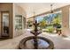 Stunning outdoor courtyard with a charming fountain, providing a tranquil and inviting ambiance at 9417 E Charter Oak Dr, Scottsdale, AZ 85260