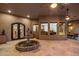 Inviting courtyard with a central fountain, seamlessly blending indoor and outdoor living spaces at 9417 E Charter Oak Dr, Scottsdale, AZ 85260