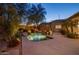 Inviting backyard pool surrounded by lush greenery, creating a serene oasis for relaxation and outdoor enjoyment at 9417 E Charter Oak Dr, Scottsdale, AZ 85260