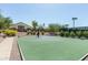 Outdoor basketball court with green and blue surfaces, set in a well-maintained community at 9540 N 114Th Way, Scottsdale, AZ 85259