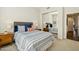 Comfortable bedroom featuring mirrored closet doors, a ceiling fan, and an inviting bed with stylish accents at 9540 N 114Th Way, Scottsdale, AZ 85259