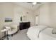 Cozy bedroom featuring a ceiling fan and a comfortable seating area with natural light at 9540 N 114Th Way, Scottsdale, AZ 85259