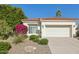 Charming home featuring a vibrant bougainvillea bush, desert landscaping, and a classic terracotta tile roof at 9540 N 114Th Way, Scottsdale, AZ 85259