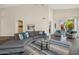 Bright living room featuring high ceilings, comfortable seating, and sliding doors to the outdoor patio at 9540 N 114Th Way, Scottsdale, AZ 85259