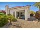 Outdoor patio with stylish seating and a view of the well-manicured yard and the home's classic architecture at 9540 N 114Th Way, Scottsdale, AZ 85259