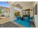 Charming covered patio area with comfortable seating, perfect for relaxing and enjoying the tranquil outdoor space at 9540 N 114Th Way, Scottsdale, AZ 85259