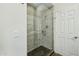 Modern bathroom showcasing a sleek, glass-enclosed shower with stylish tile and a convenient shower head at 9540 N 114Th Way, Scottsdale, AZ 85259
