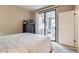 Cozy bedroom features a sliding glass door with access to the balcony at 9708 E Via Linda -- # 1338, Scottsdale, AZ 85258