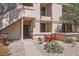Multi-level building with stucco facade, desert landscaping, and a walkway leading to the front entrance at 9708 E Via Linda -- # 1338, Scottsdale, AZ 85258