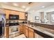 Well-lit kitchen features stainless steel appliances and a granite countertop at 9708 E Via Linda -- # 1338, Scottsdale, AZ 85258