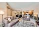 Open-concept living area features tile flooring, neutral paint, and seamless flow to dining and kitchen at 9708 E Via Linda -- # 1338, Scottsdale, AZ 85258