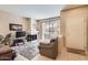 Bright living room boasts a cozy fireplace, a sliding glass door, and neutral tones at 9708 E Via Linda -- # 1338, Scottsdale, AZ 85258